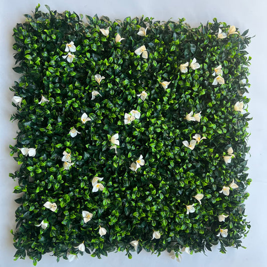 20x20 dense green artificial greenery wall panels with subtle white floral accents, interlocking faux green wall
