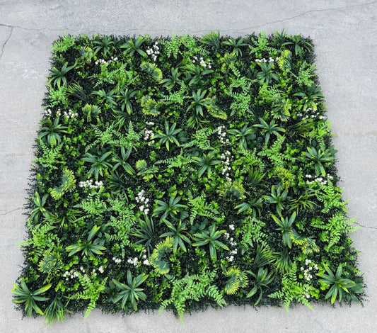 Multiple 20x20 artificial greenery wall panels connected to form a dense green wall backdrop with seamless coverage