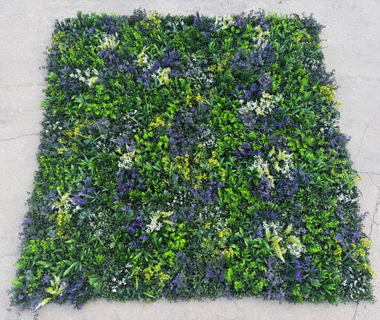 Multiple 20x20 cool tone artificial greenery wall panels connected to form a seamless decorative green wall