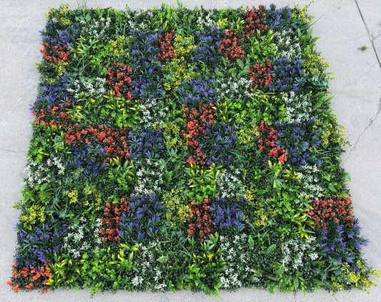 Multiple 20x20 artificial greenery wall panels connected to form a vibrant multi-tone foliage wall with leaf-based color variation