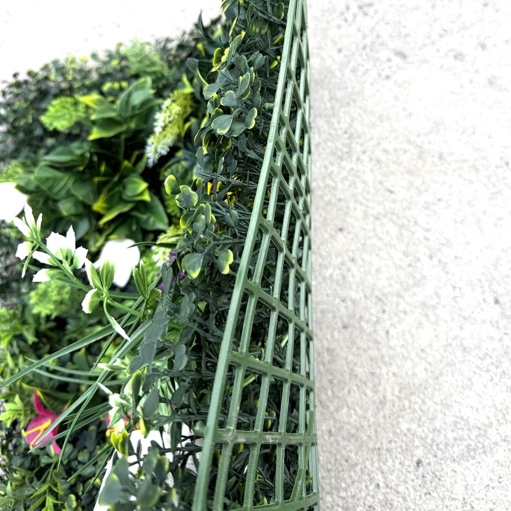 Side view of 20x20 artificial greenery wall panel showing dense layered foliage and realistic depth