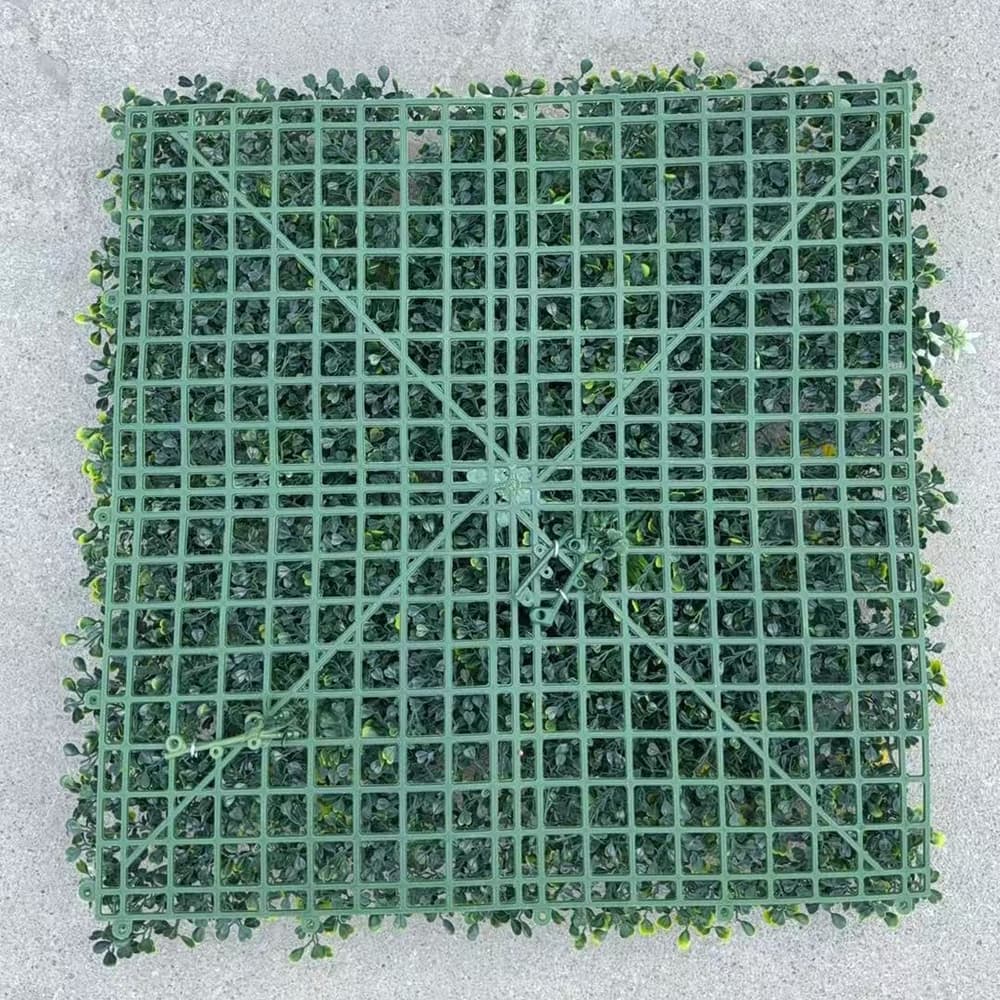 Back view of artificial greenery wall panel showing interlocking grid backing for secure installation
